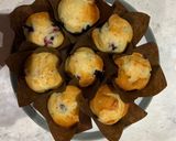 A picture of step 6 of Lemon and blueberry drizzle muffins.