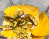 A picture of step 1 of Mango walnuts smoothie.