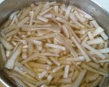 A picture of step 1 of Thor Muri Ghonto (Banana Stem cooked with Rice).
