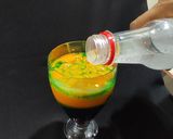A picture of step 3 of Devil's Knight Layered Mocktail.