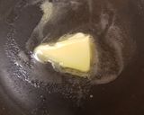 A picture of step 1 of Buttered Mushrooms in a little white wine and Balsamic Vinegar.