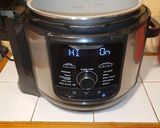 A picture of step 1 of Yellow Rice with Pork Ribs in the Ninja Foodi.