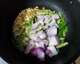 A picture of step 1 of Tamarind poha.