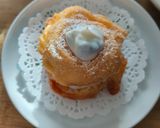 Foto del passaggio 5 della ricetta Zeppole fritte con ricotta gocce di cioccolato e arancia candita