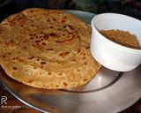 A picture of step 4 of Lachcha paratha with wheat flour and til lahsun chutney.