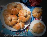 A picture of step 14 of Pumpkin shaped dinner rolls.