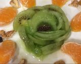 Foto del paso 3 de la receta: Desayuno saludable: kiwi, mandarina, nueces, pasas y miel