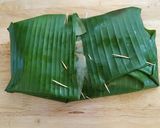 A picture of step 11 of Paneer wrapped in banana leaf.