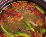 A picture of step 5 of Khanom Jeen Nam Ngiao (Northern Thai Noodle Soup).