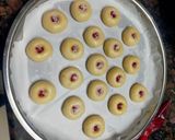 A picture of step 4 of Thumb Print Jam Cookies with White Butter.