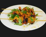 A picture of step 5 of Paneer Tikka with colorful veggies.