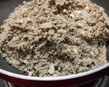 A picture of step 4 of Wheat flour seeds and nuts Ladoo with leftover ghee residue.