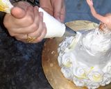 A picture of step 8 of Eggless Doll cake pineappple flavour.