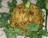 A picture of step 3 of Jhatpata allu with zeera rice.