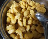 A picture of step 4 of Moong Dal steam pakode with curry.