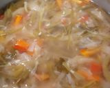 A picture of step 3 of Manchow Soup / Veg soup topped with Crispy fried noodles.