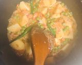 A picture of step 6 of Mutter Alo pulao.
