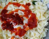 A picture of step 4 of Farfalle Pasta with cheese & Schezwan sauce.