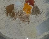 A picture of step 2 of Multigrain Atta Brinjal & Curd Thalipith.