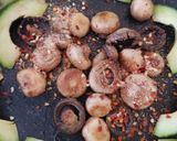 A picture of step 5 of My Buttered Salt n pepper Mushroomson,Advocado on bed of Spinach.