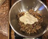 A picture of step 3 of Shaved beef stuff pepper with white Queso cheese.