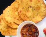 A picture of step 4 of Patheera with onion sauce.