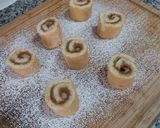 A picture of step 17 of Mini Hazelnut and Walnut Praline Piononos with Pastry Cream.