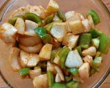 A picture of step 2 of Chicken with Potatoes and Bell Pepper in the Air Fryer.