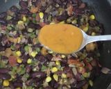 A picture of step 4 of Peri Peri Egg Beans.