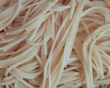 A picture of step 1 of Garlic burnt Spaghetti with red sauce.