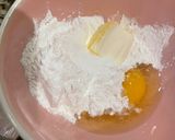 A picture of step 2 of Cassava Cake with Coconut and Pecans.