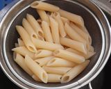 A picture of step 1 of Penne Pasta in cheesy oats white sauce.