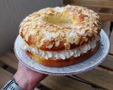 A picture of step 8 of Roscón de Reyes 2025 v2: With Almonds, Sugar, and Whipped Cream Filling.