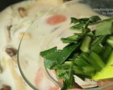 A picture of step 12 of Tom Kha Gai with King Oyster Mushrooms.