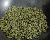 A picture of step 1 of Masala Roasted Pumpkin Seeds.