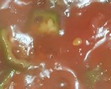 A picture of step 5 of Μπάμιες/Bamies--Greek style braised okra with tomatoes.