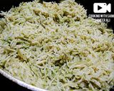 A picture of step 6 of Thai green rice with fried fish.