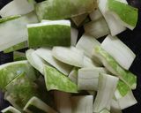 A picture of step 1 of Lau Khosa Posto Bhaja aka Roasted Bottle Gourd Peel.