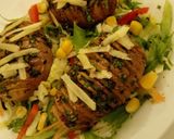 A picture of step 3 of Hasselback Potatoes Served with garden fresh salad.