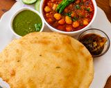 A picture of step 10 of Shahi Chhole Bhature prepared with garam masala.