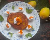 A picture of step 6 of Mango malpua with fresh cream.