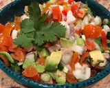 A picture of step 5 of Ceviche with avocado, cherry tomatoes and spring onions.