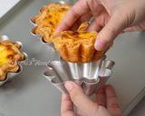 A picture of step 14 of Mini Flower-Shaped Portuguese Egg Tarts with Puff Pastry.
