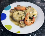 Foto del paso 7 de la receta: Merluza en salsa con almejas y langostinos