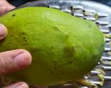 A picture of step 1 of Green raw mango rice.