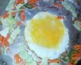 A picture of step 3 of Cabbage plated noodles with veggies and egg.