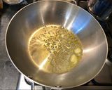 A picture of step 3 of Penne al'arrabiata (pasta with a spicy tomato sauce).