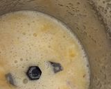 A picture of step 2 of Mulberry Orange Sunset layered Mocktail.