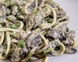 A picture of step 6 of Tagliolini with Truffle, Mushrooms, Peas, and Sausage.