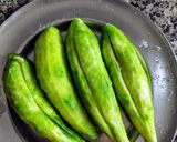 A picture of step 1 of Pyaazi karela (bittergourd in onion masala).